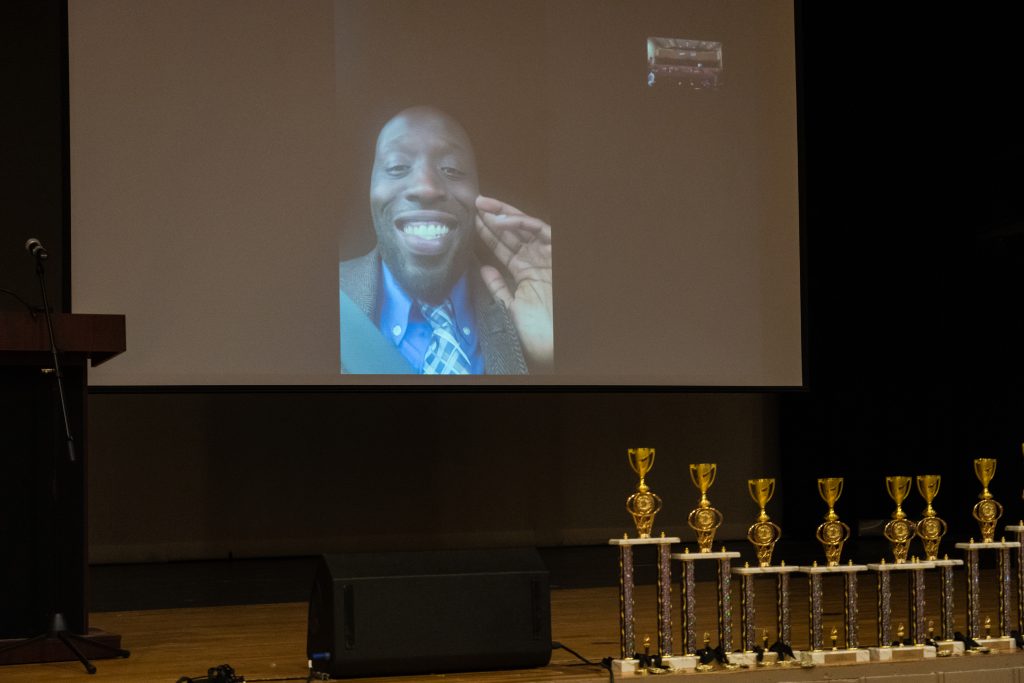 Councilmember-at-Large Isaiah Thomas tunes in virtually to congratulate high school debate finals competitors
